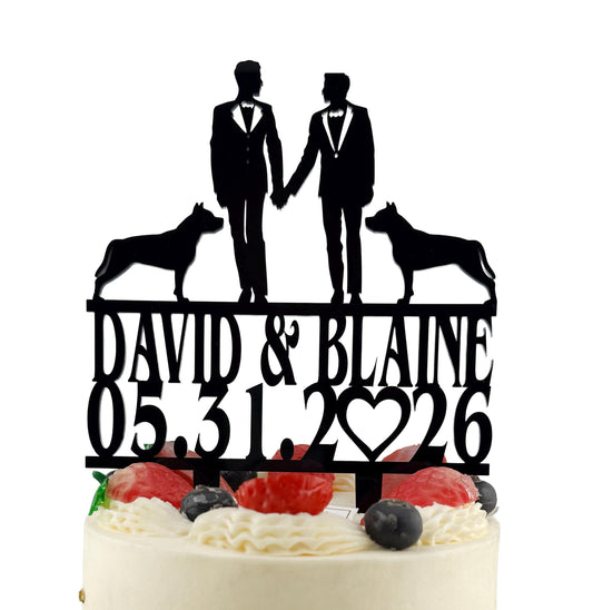 A black silhouette of two men in suits standing on top of a cake with a heart and the date "05.31.26" written on it.
