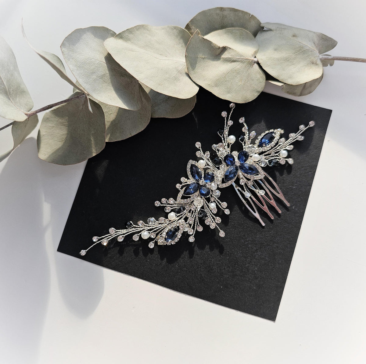 a close up of a brooch on a table