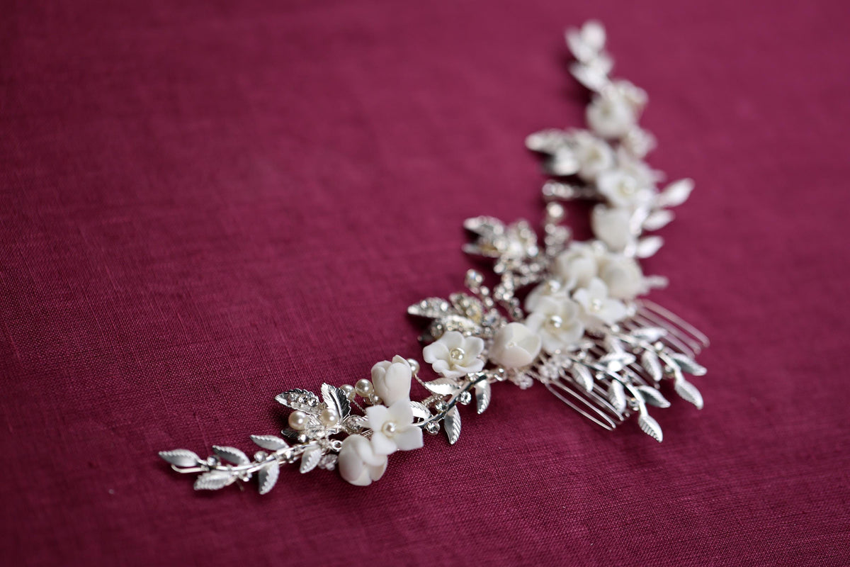 a close up of a hair comb with flowers on it