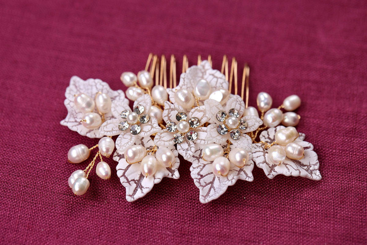 a close up of a hair comb with pearls