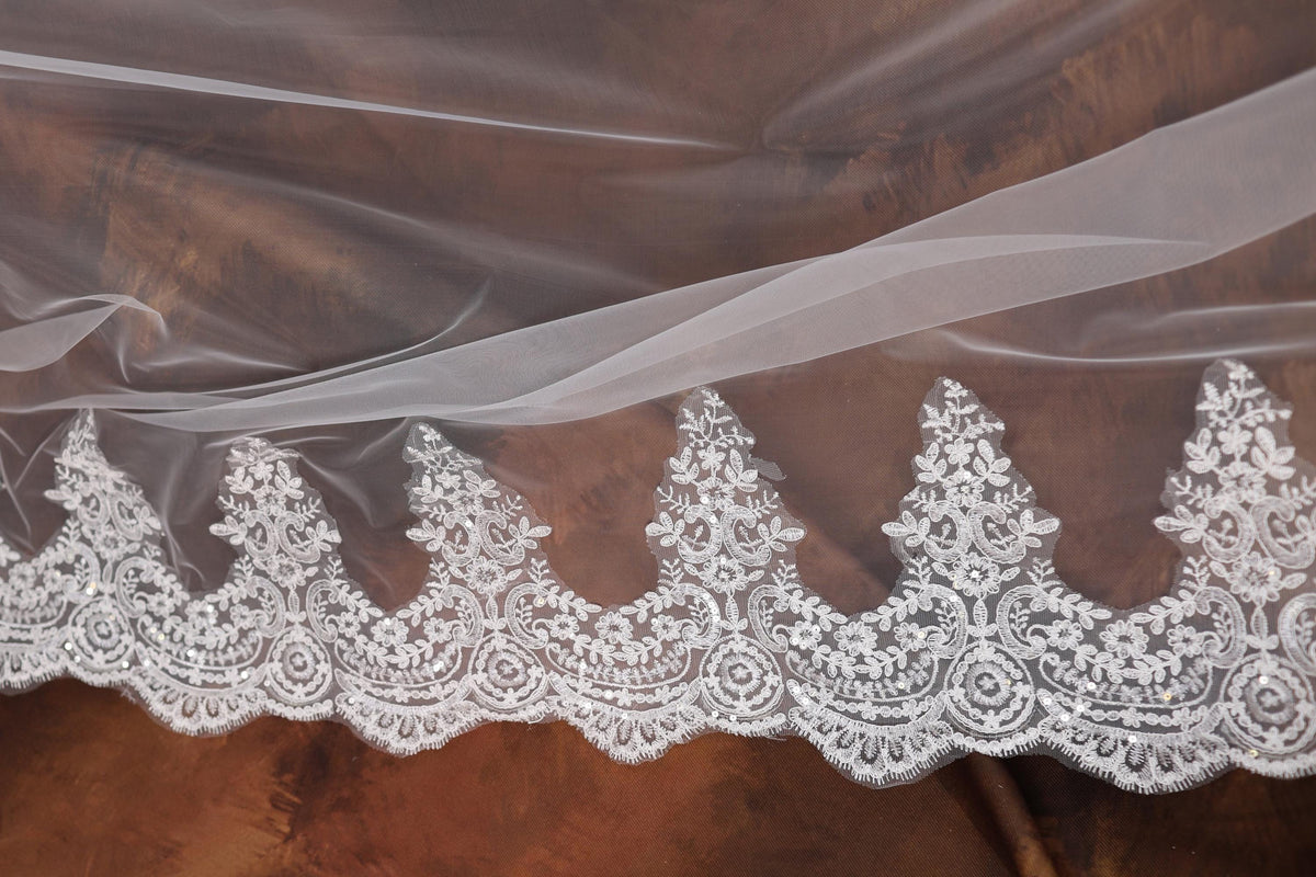 a close up of a white lace on a fabric