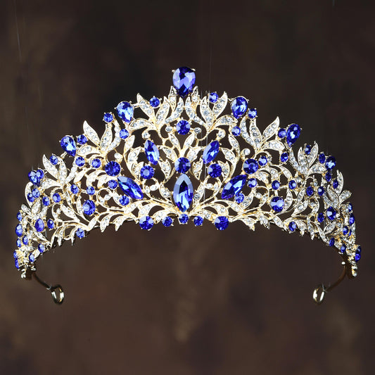 a tiara with blue and white stones on it