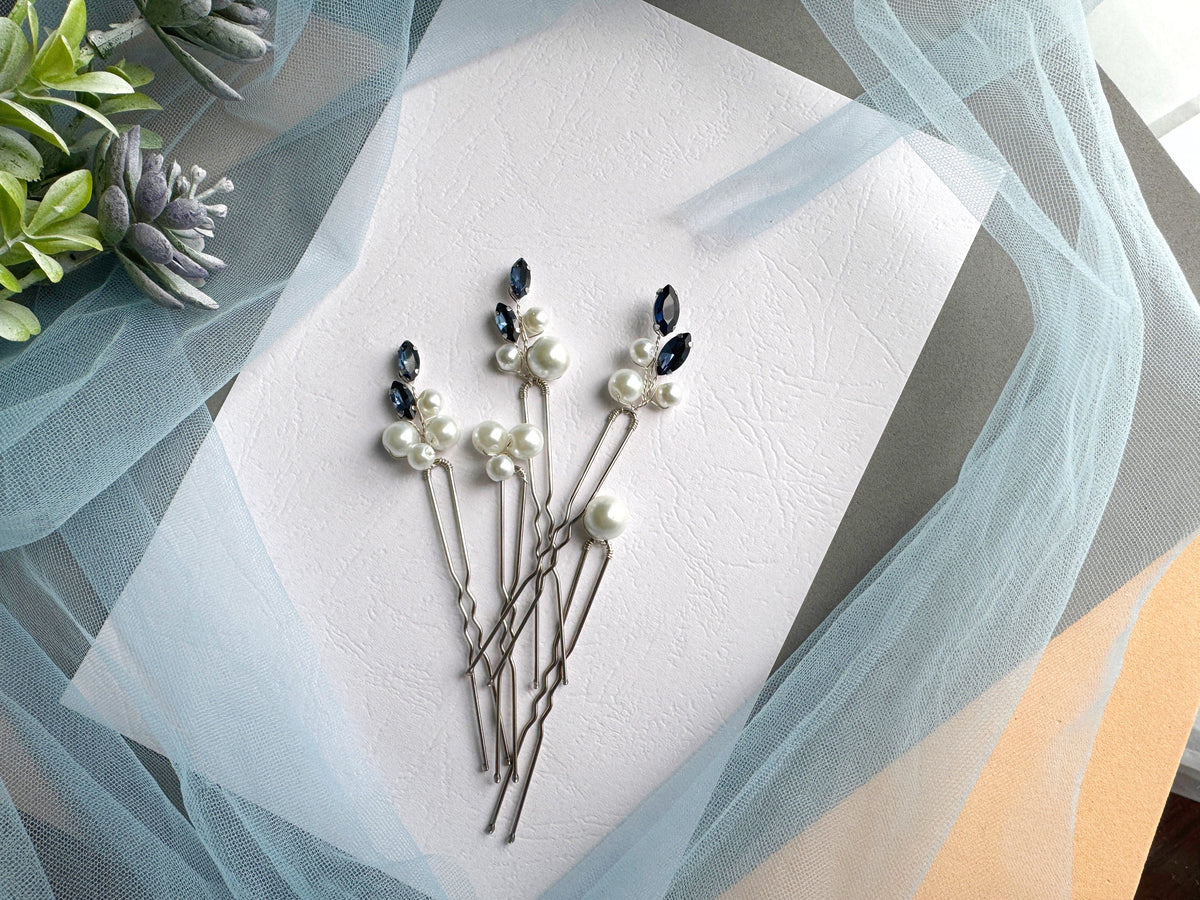 a bunch of pins sitting on top of a piece of paper