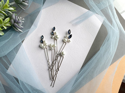 a bunch of pins sitting on top of a piece of paper