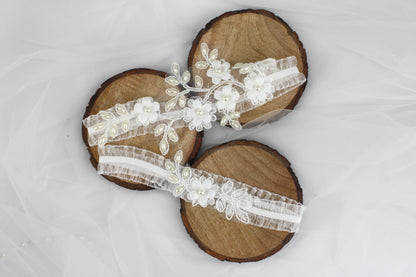 a pair of wooden sandals with white flowers on them
