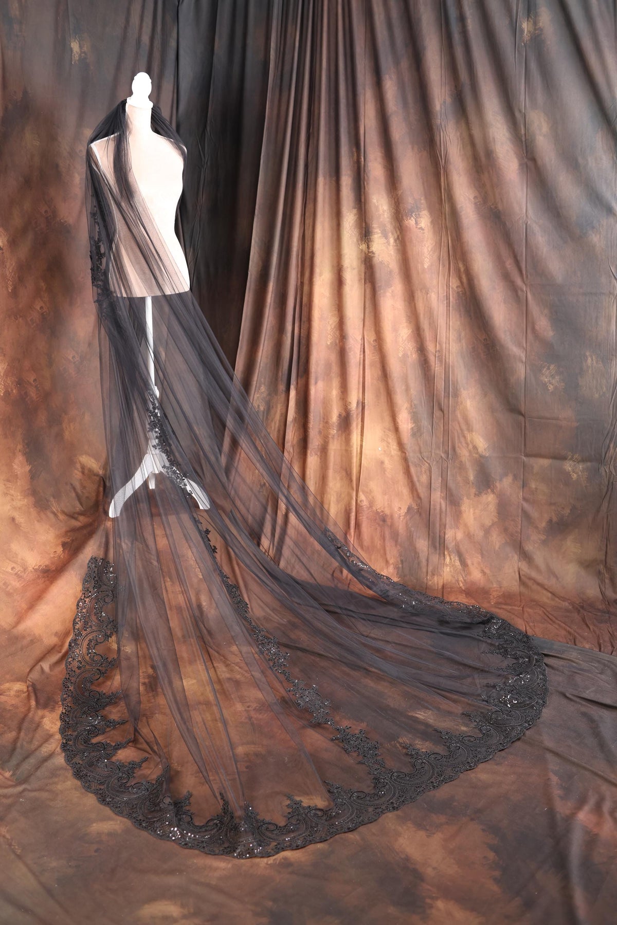 a mannequin dressed in a black and white gown