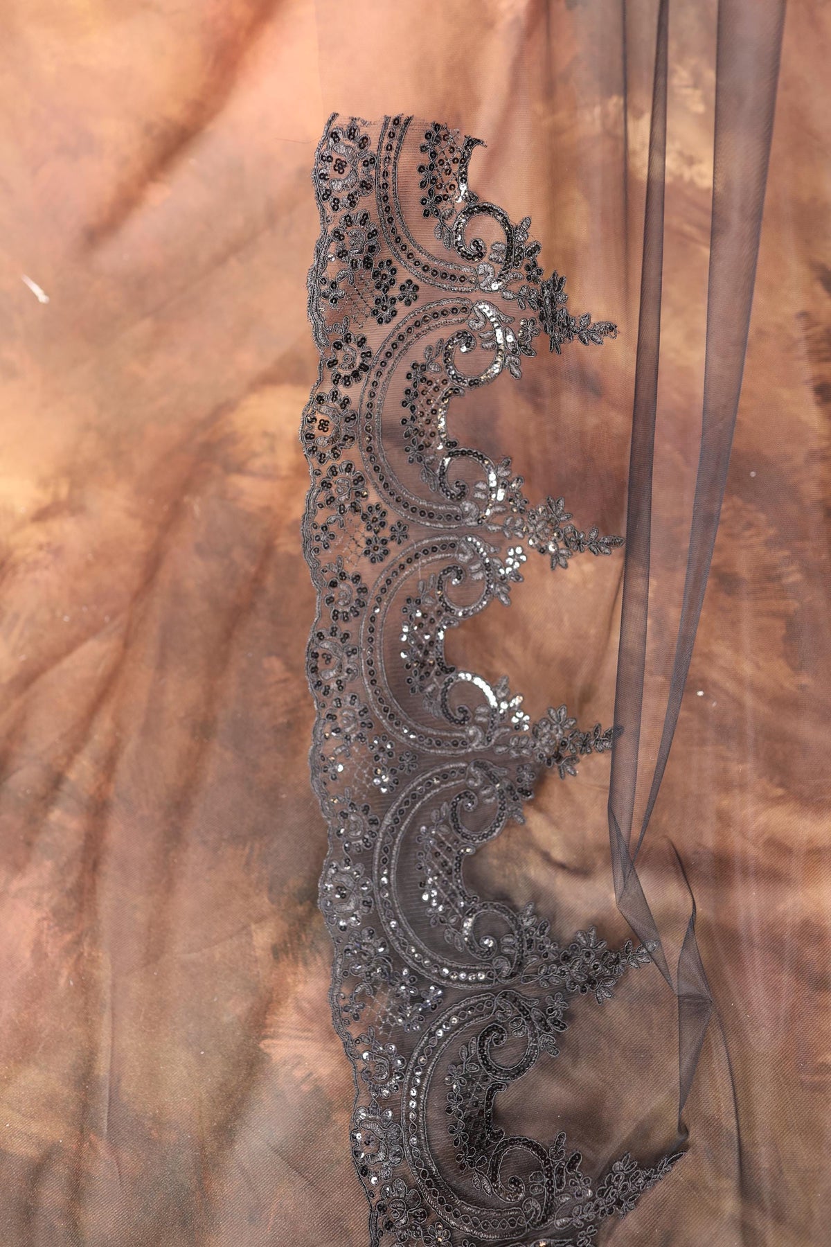 a close up of a sheer fabric with a design on it