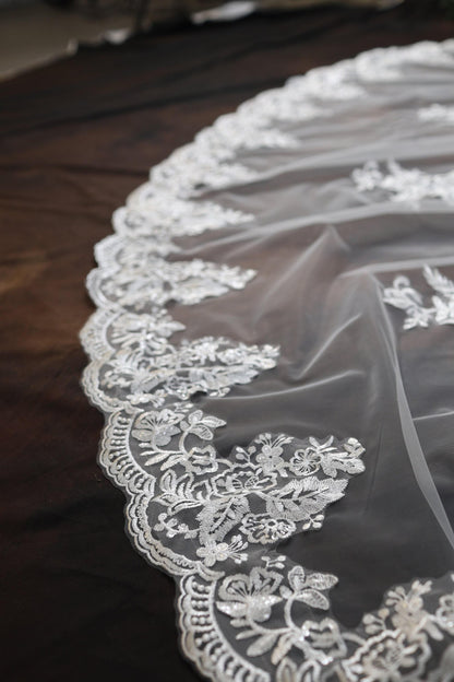 a close up of a wedding veil on a table