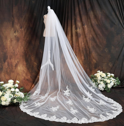 a bridal veil on a mannequin with flowers