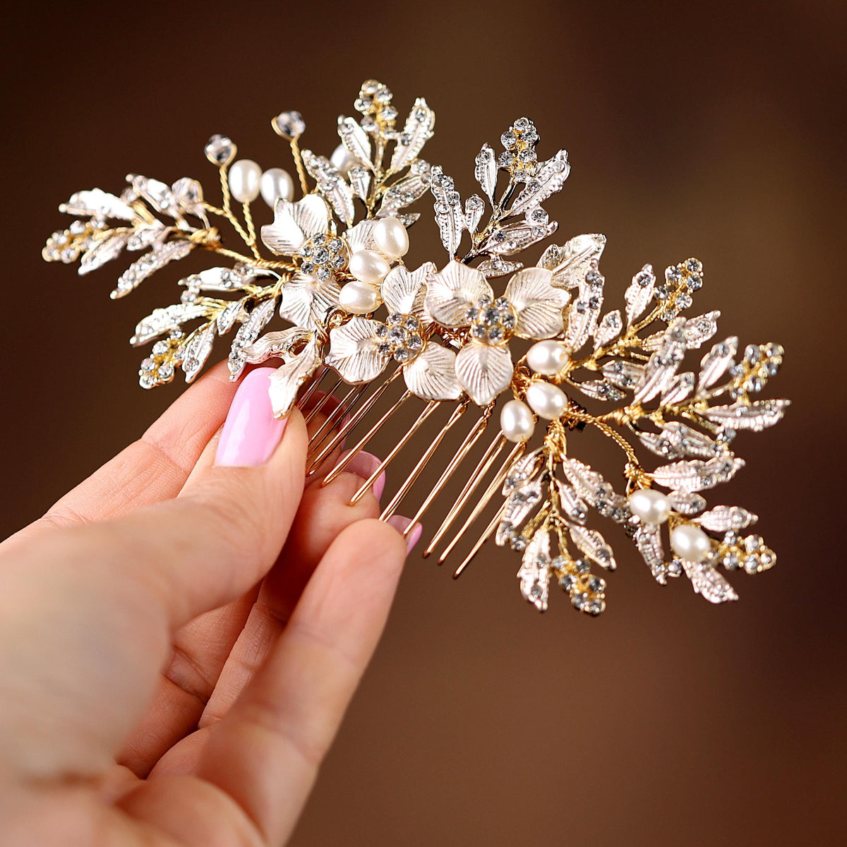 a close up of a person holding a hair comb