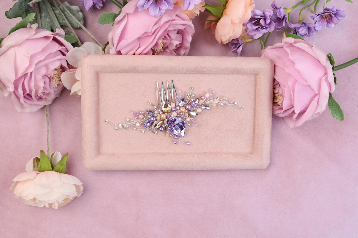 a table topped with flowers and a plate with a hair comb on it