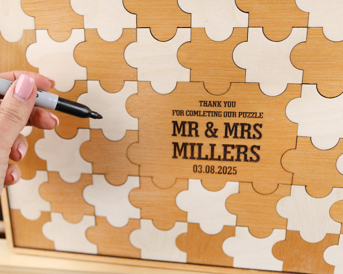 a person holding a pen in front of a puzzle