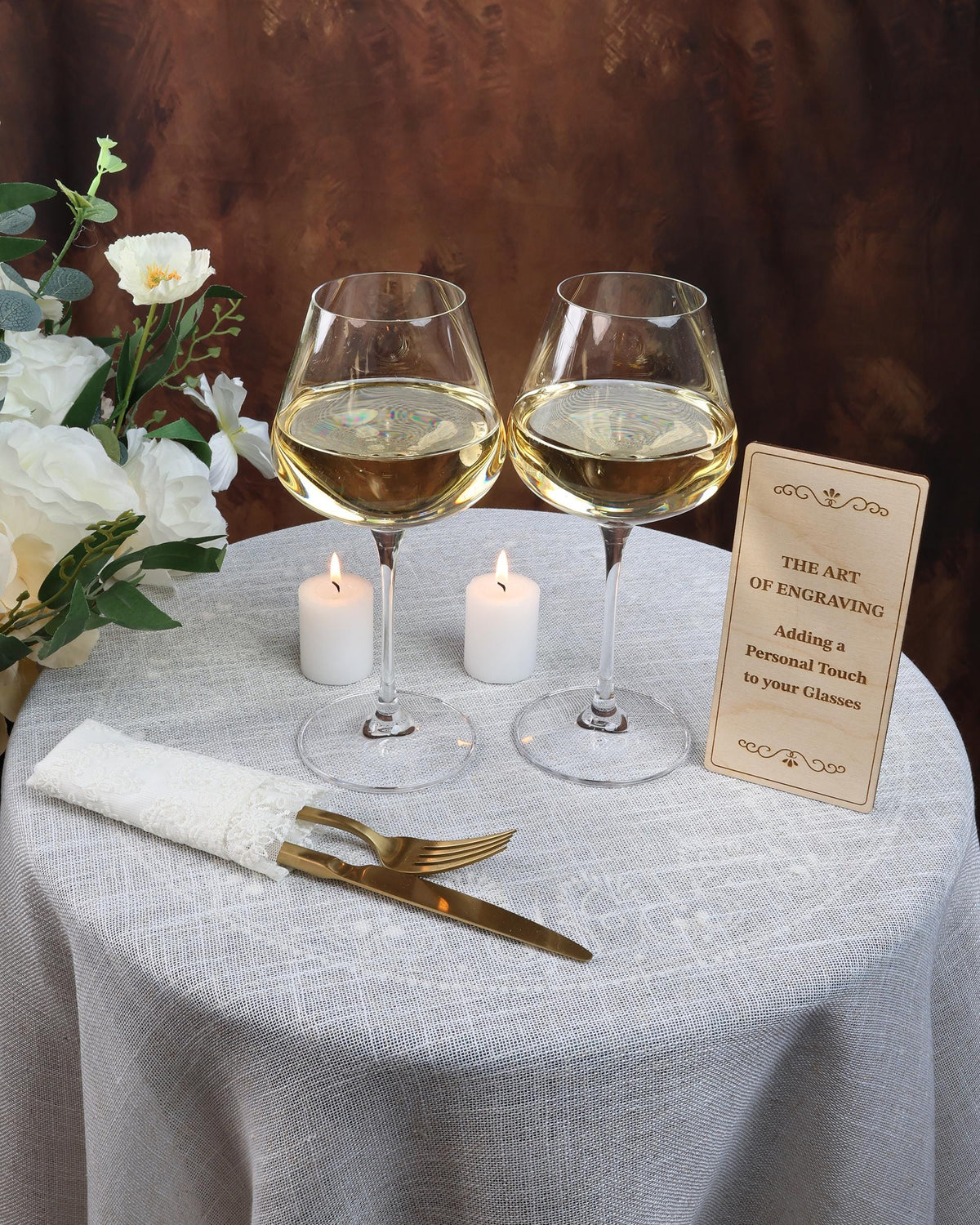 two glasses of wine on a table with a menu
