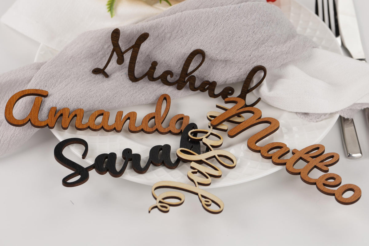 a close-up of a table setting with several personalized nameplate holders.