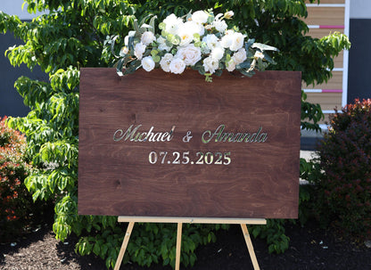 a wooden sign with a bouquet of flowers on top of it