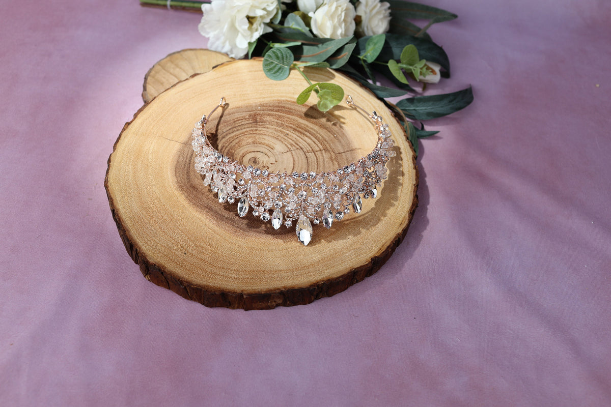 a close up of a necklace on a piece of wood