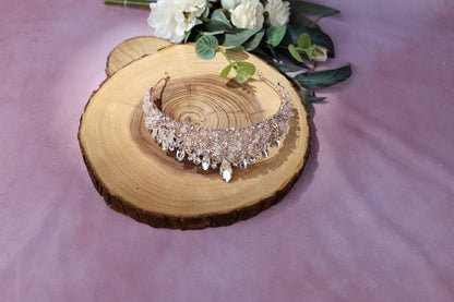 a close up of a necklace on a piece of wood