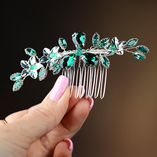 a close up of a person holding a hair comb