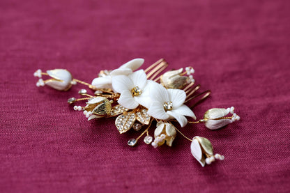 a close up of a hair comb with flowers on it