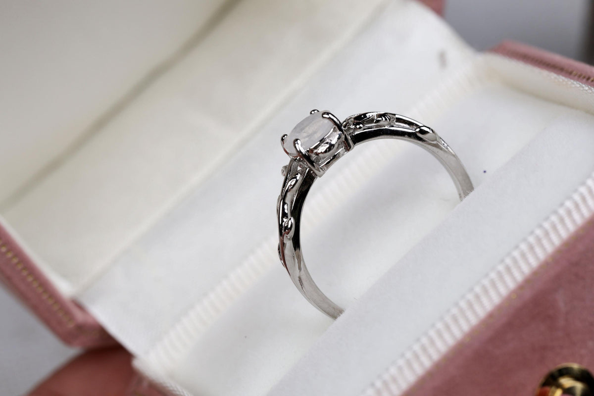 a close up of a ring in a box