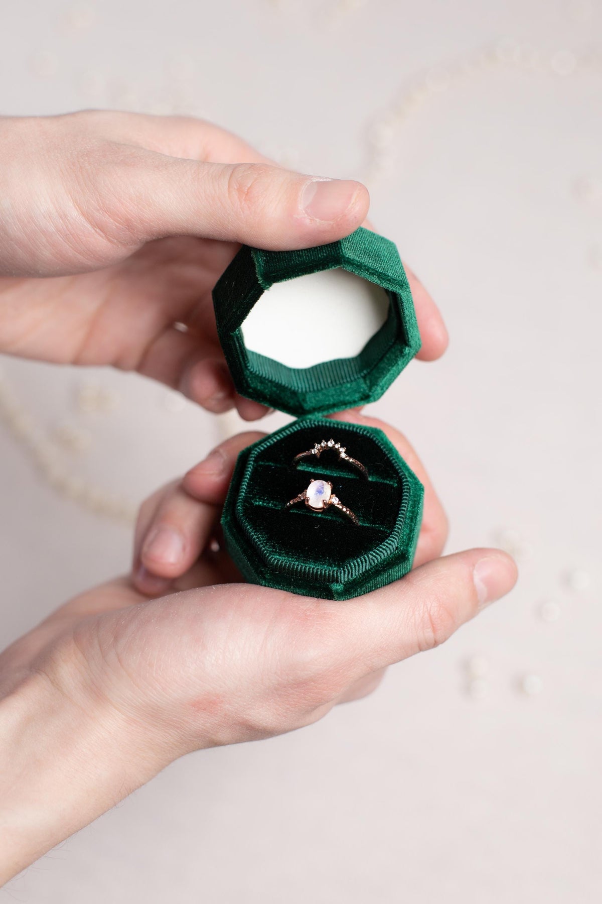a person holding a ring in their hand