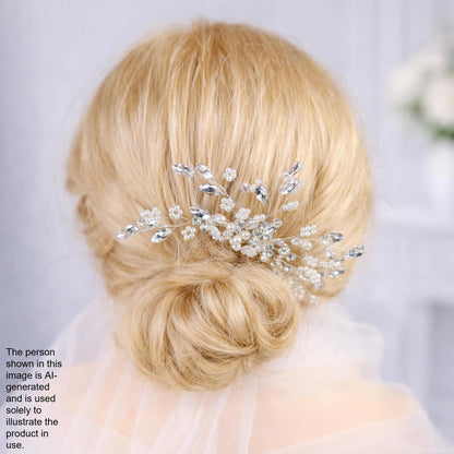 A close-up view of a woman's blonde hair with a decorative hair accessory, possibly a veil or headpiece, in the background.