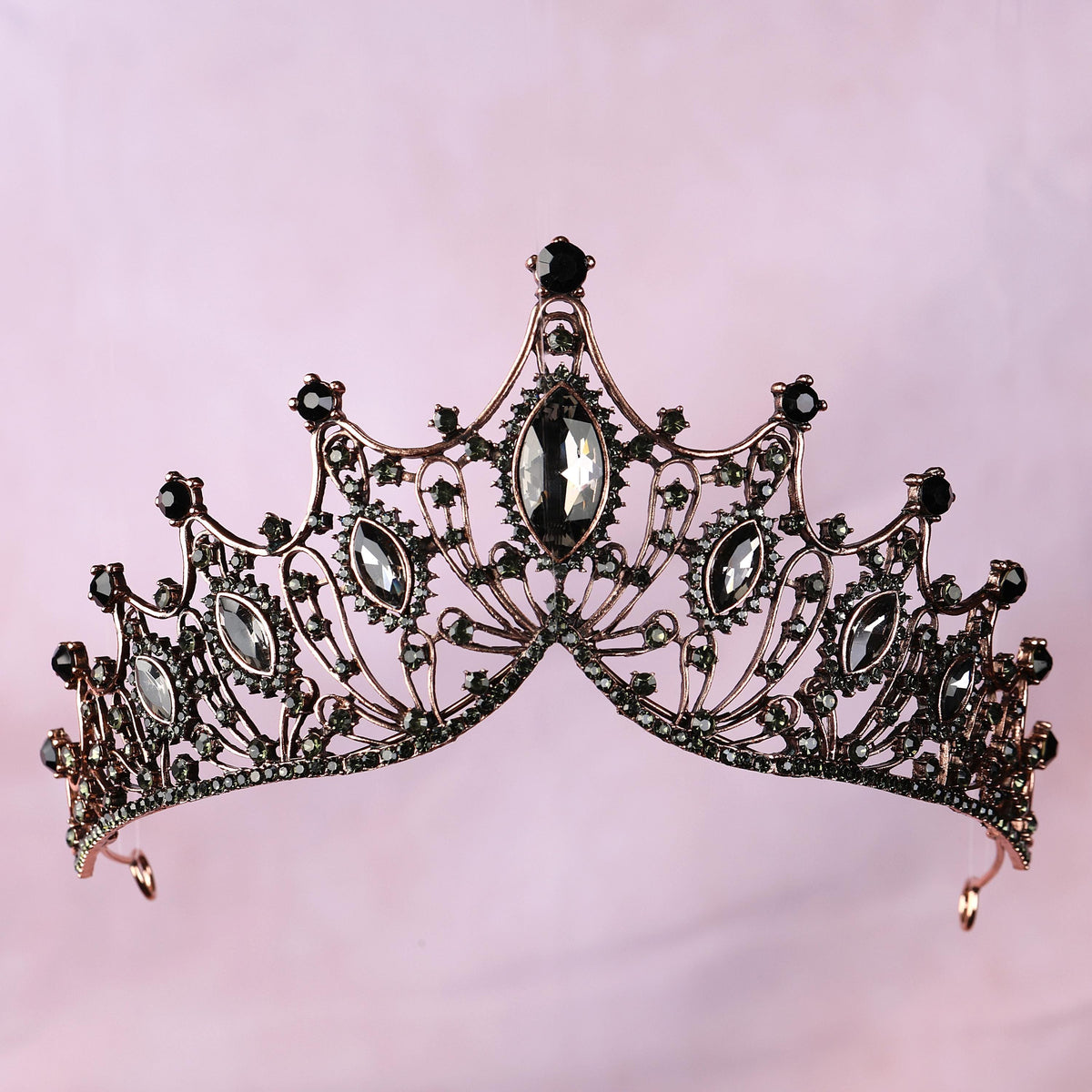 a tiara with a black diamond on top of it