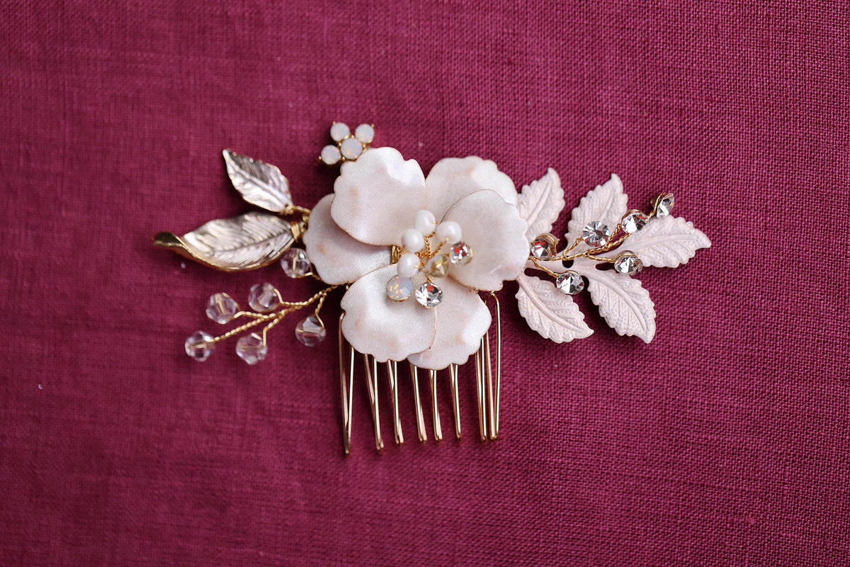 a close up of a hair comb with flowers on it
