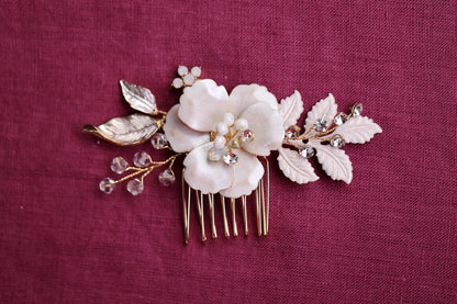a close up of a hair comb with flowers on it