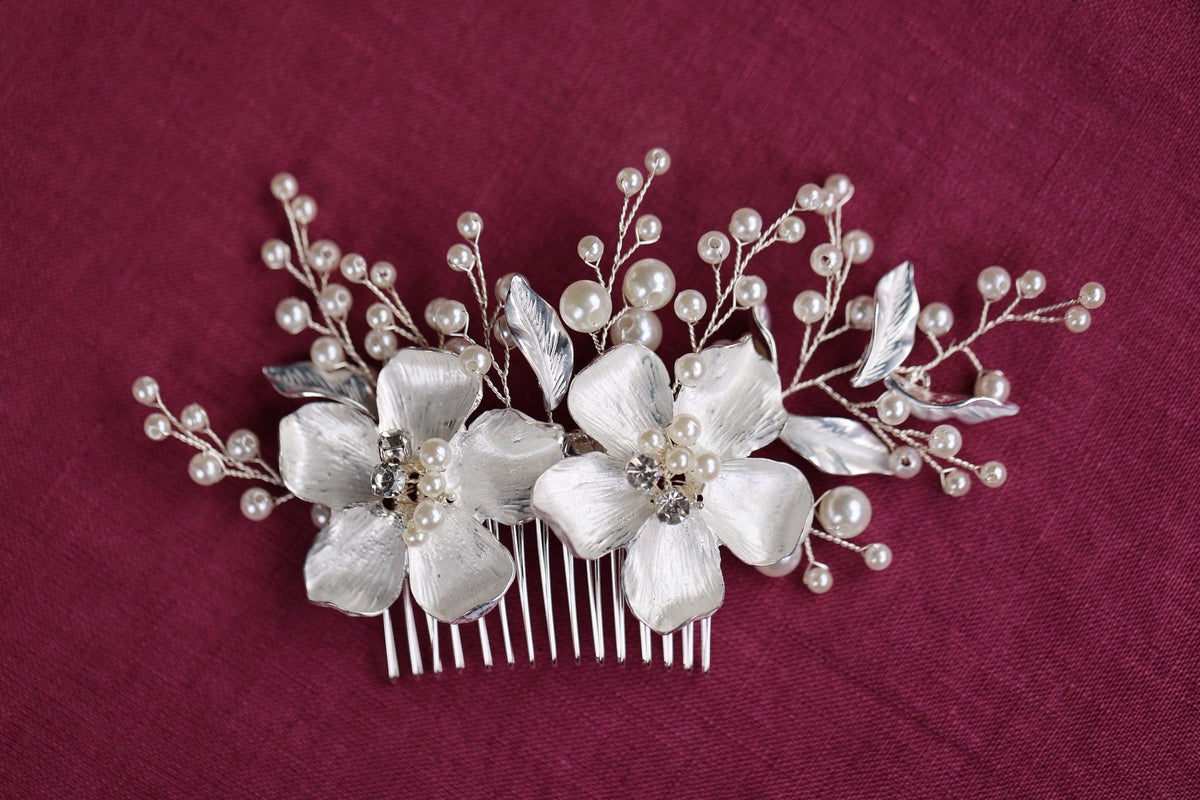 a close up of a hair comb with flowers on it
