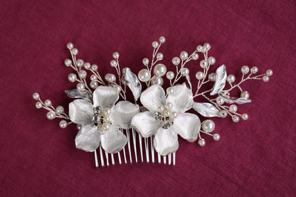 a close up of a hair comb with flowers on it