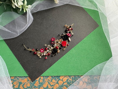 a close up of a brooch with flowers on it