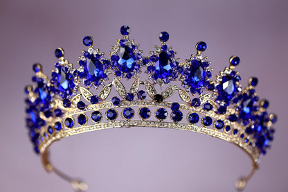 a tiara with a lot of blue stones on it