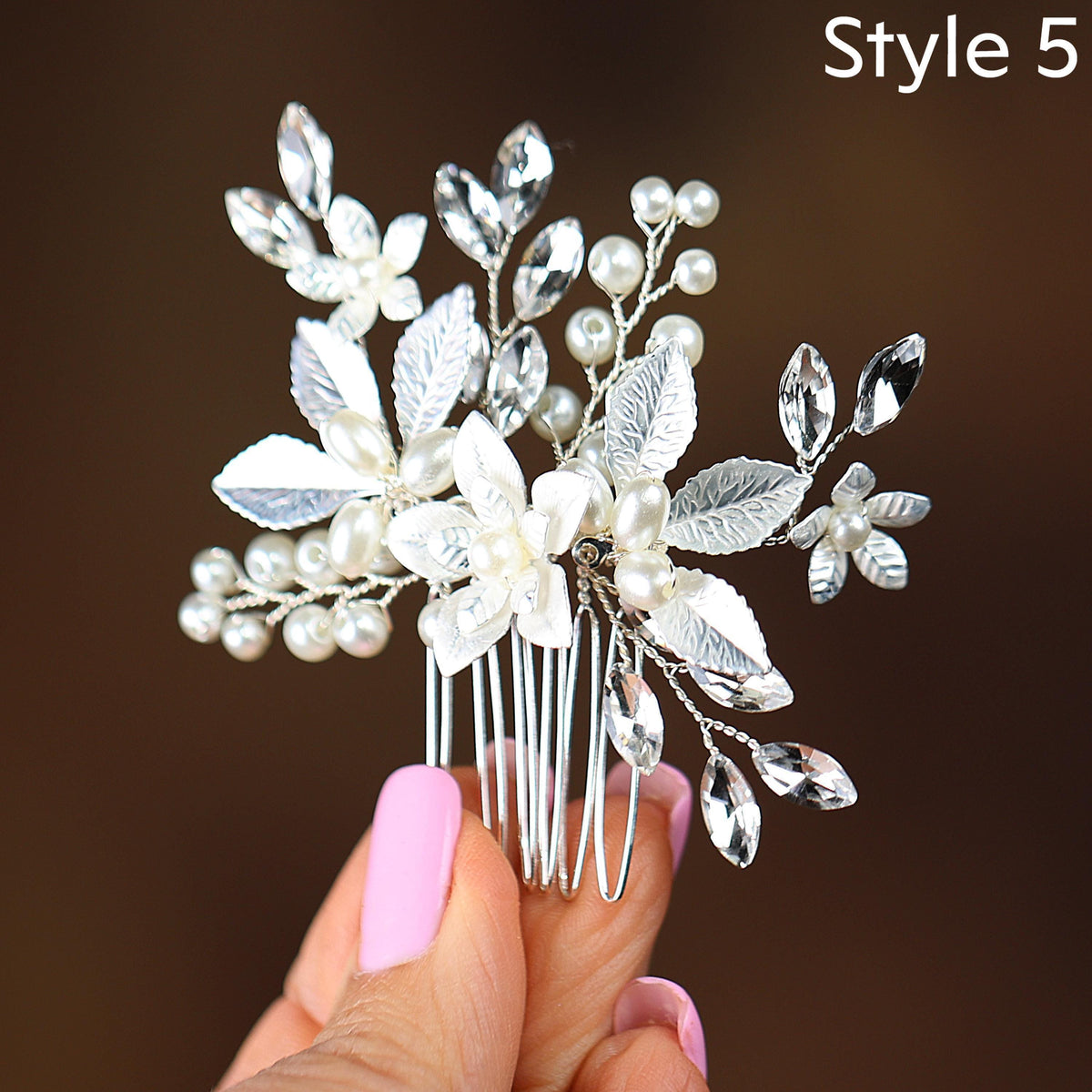 a close up of a person holding a hair comb