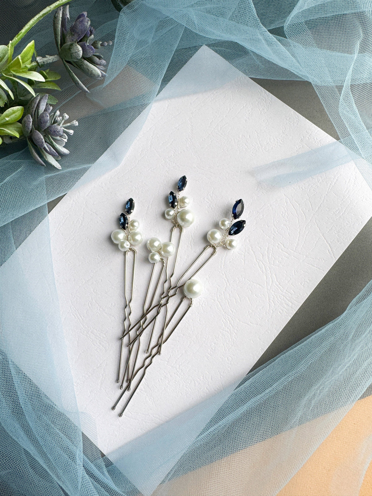 a bunch of pins sitting on top of a piece of paper