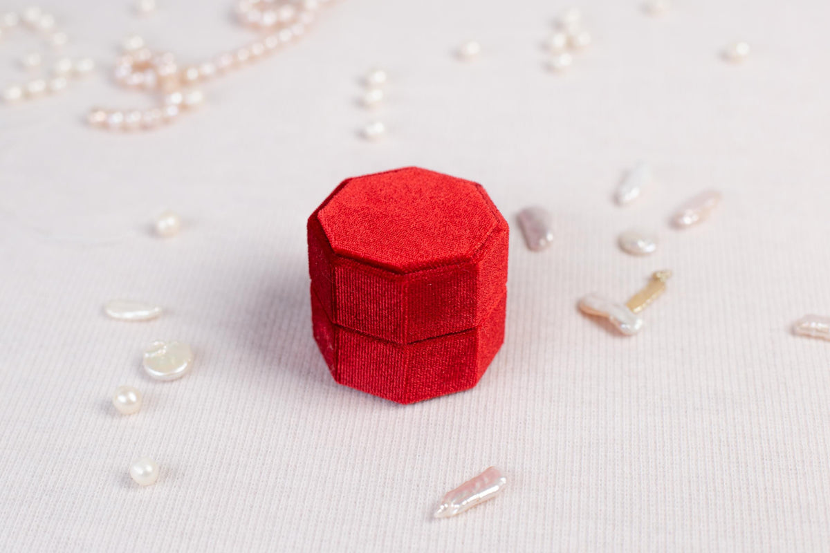 a red object sitting on top of a white table