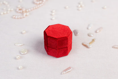 a red object sitting on top of a white table