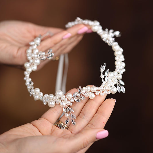 a close up of a person holding a piece of jewelry