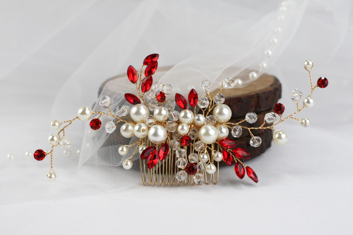 a bridal hair comb with red and white pearls