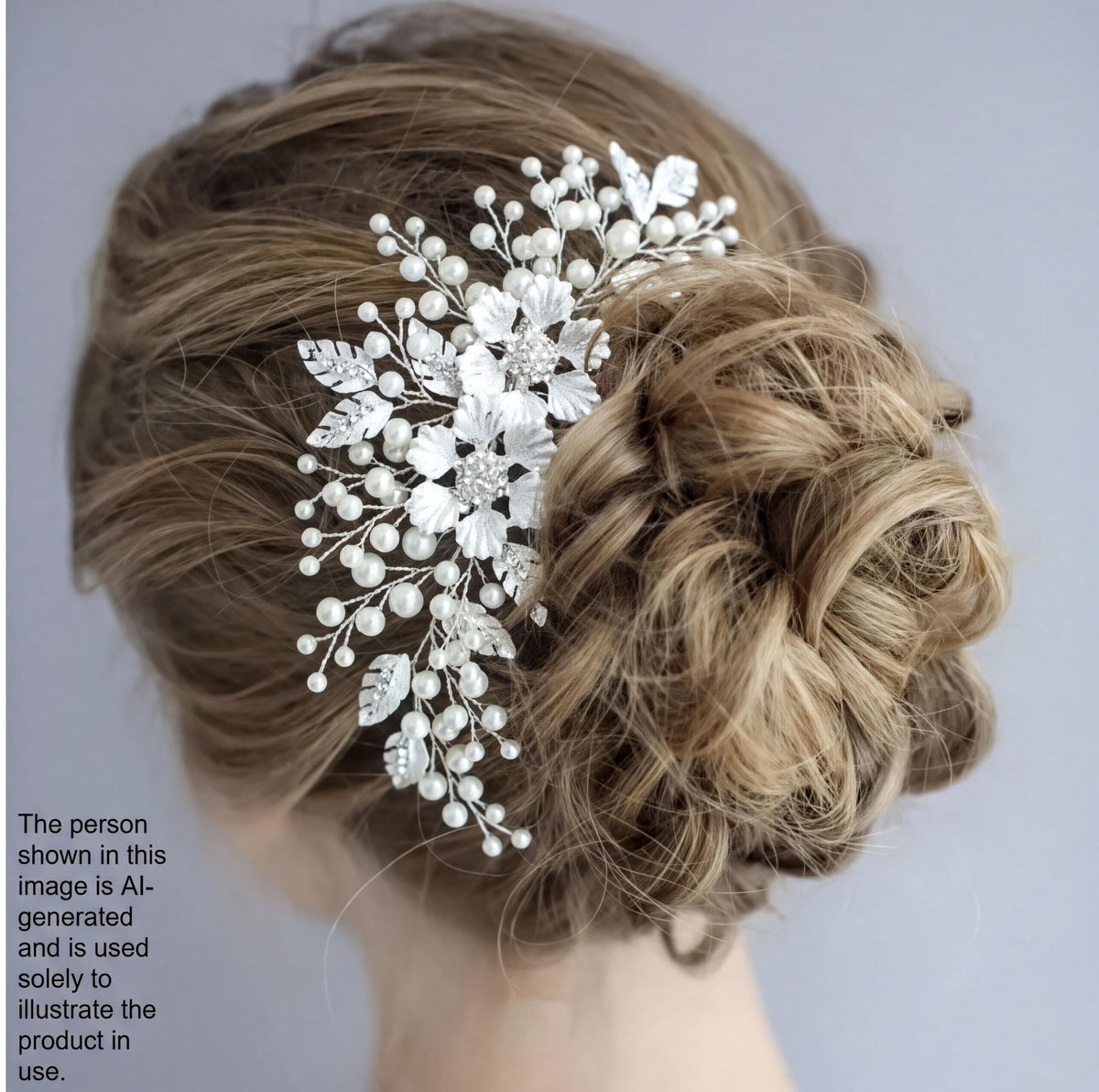 a close-up view of a woman's hair, with a decorative hair accessory featuring white flowers and leaves.