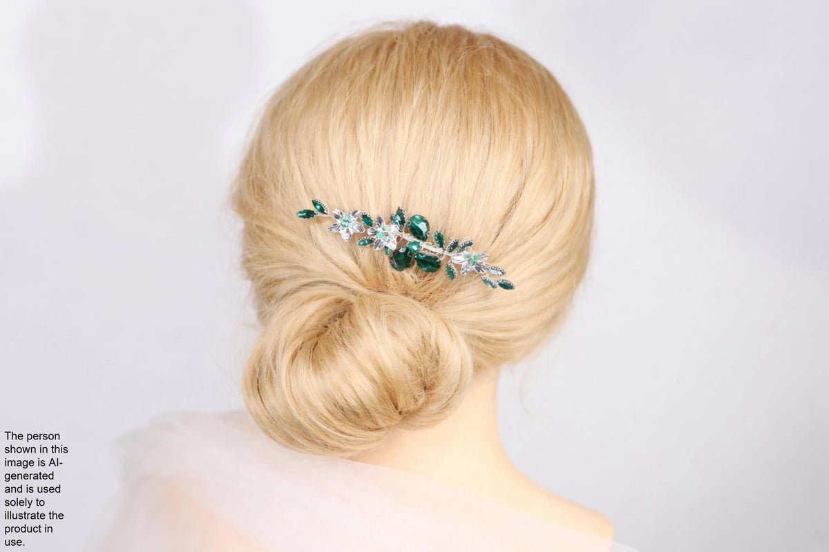 A woman with blonde hair is shown from behind, wearing a green and silver hair accessory.