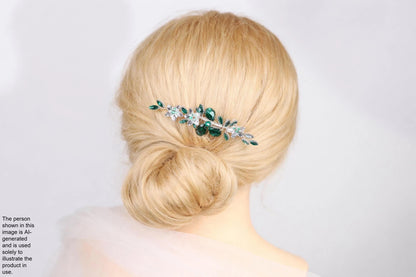 A woman with blonde hair is shown from behind, wearing a green and silver hair accessory.