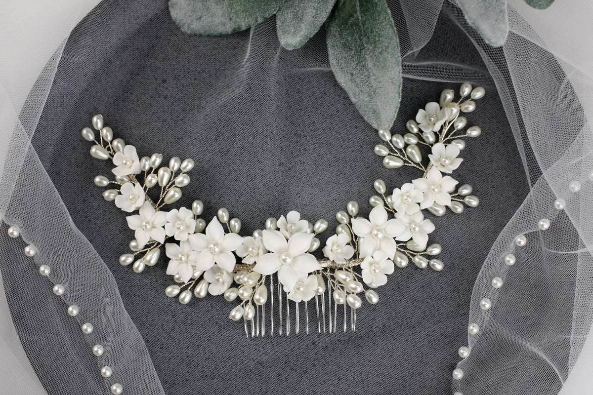 a bridal hair comb with flowers and pearls