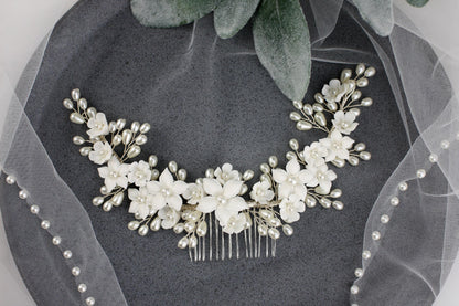a bridal hair comb with flowers and pearls