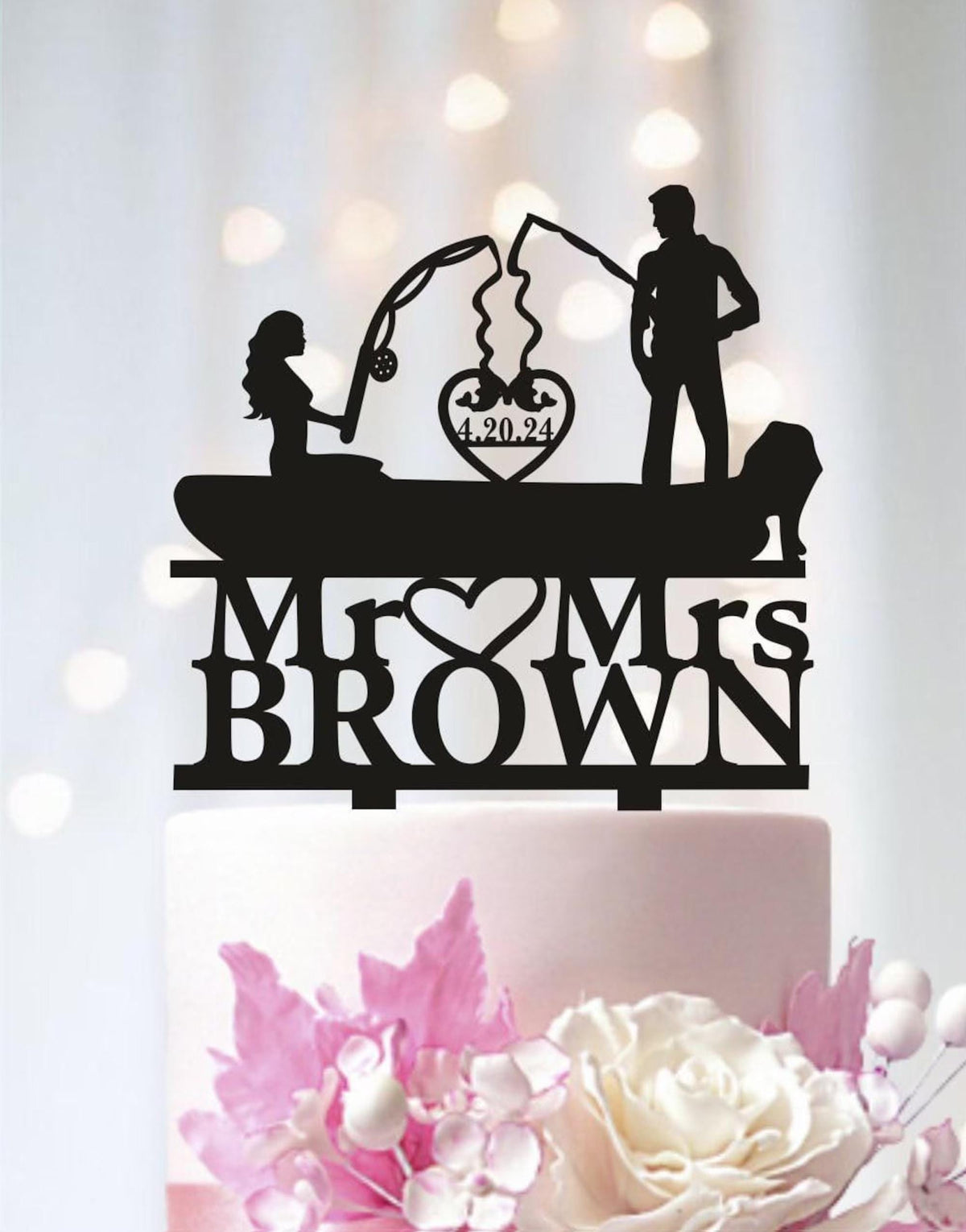 A black silhouette of a man and a woman fishing on a boat, with the text "Mr. BROWN" and the date "4.20.24" displayed on the boat.