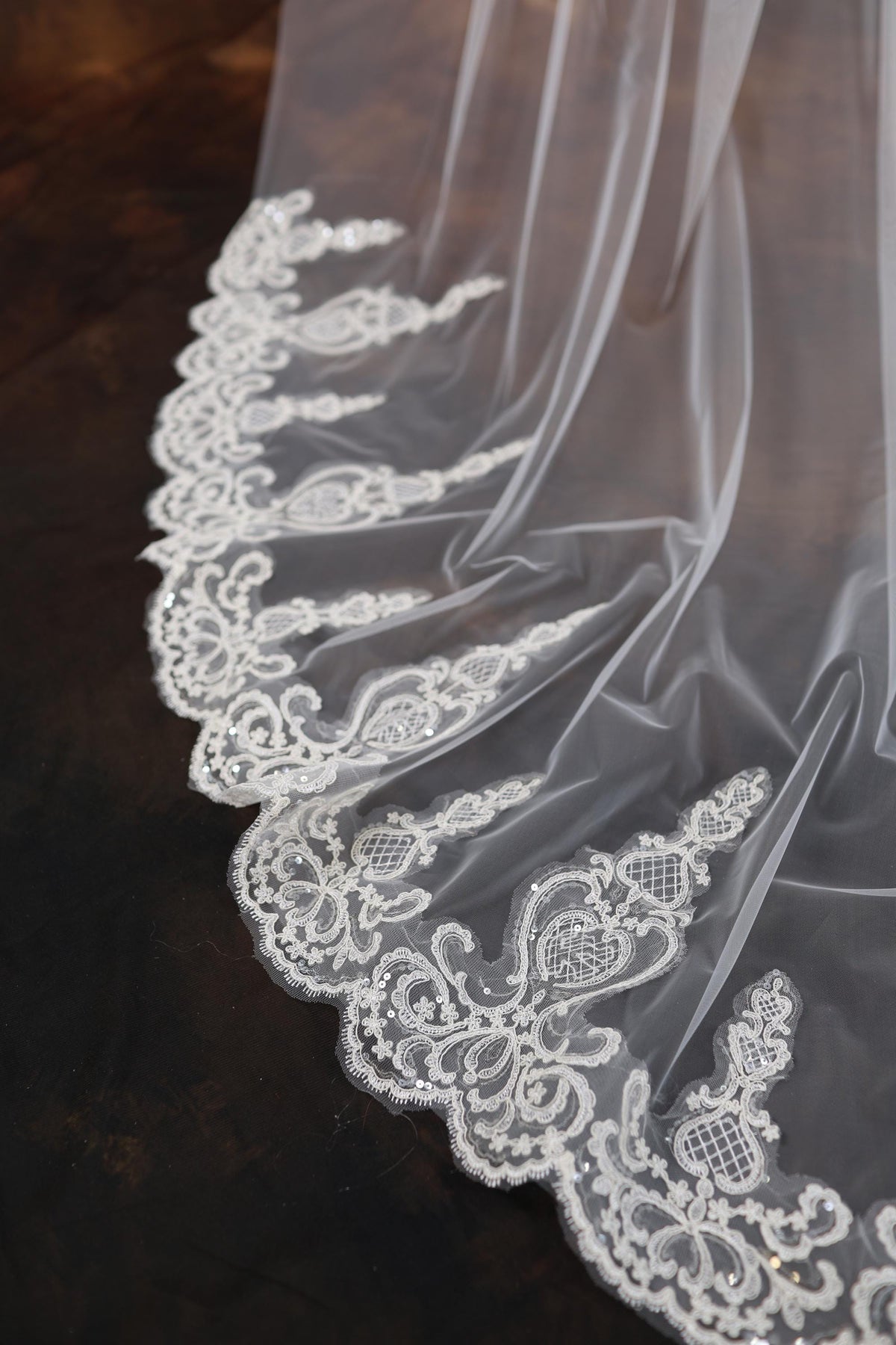 a close up of a wedding veil on a table