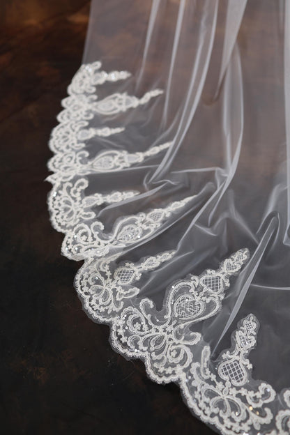 a close up of a wedding veil on a table