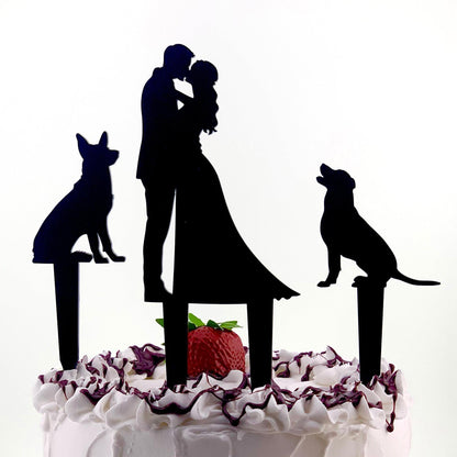 a wedding cake with a silhouette of a couple and their dog