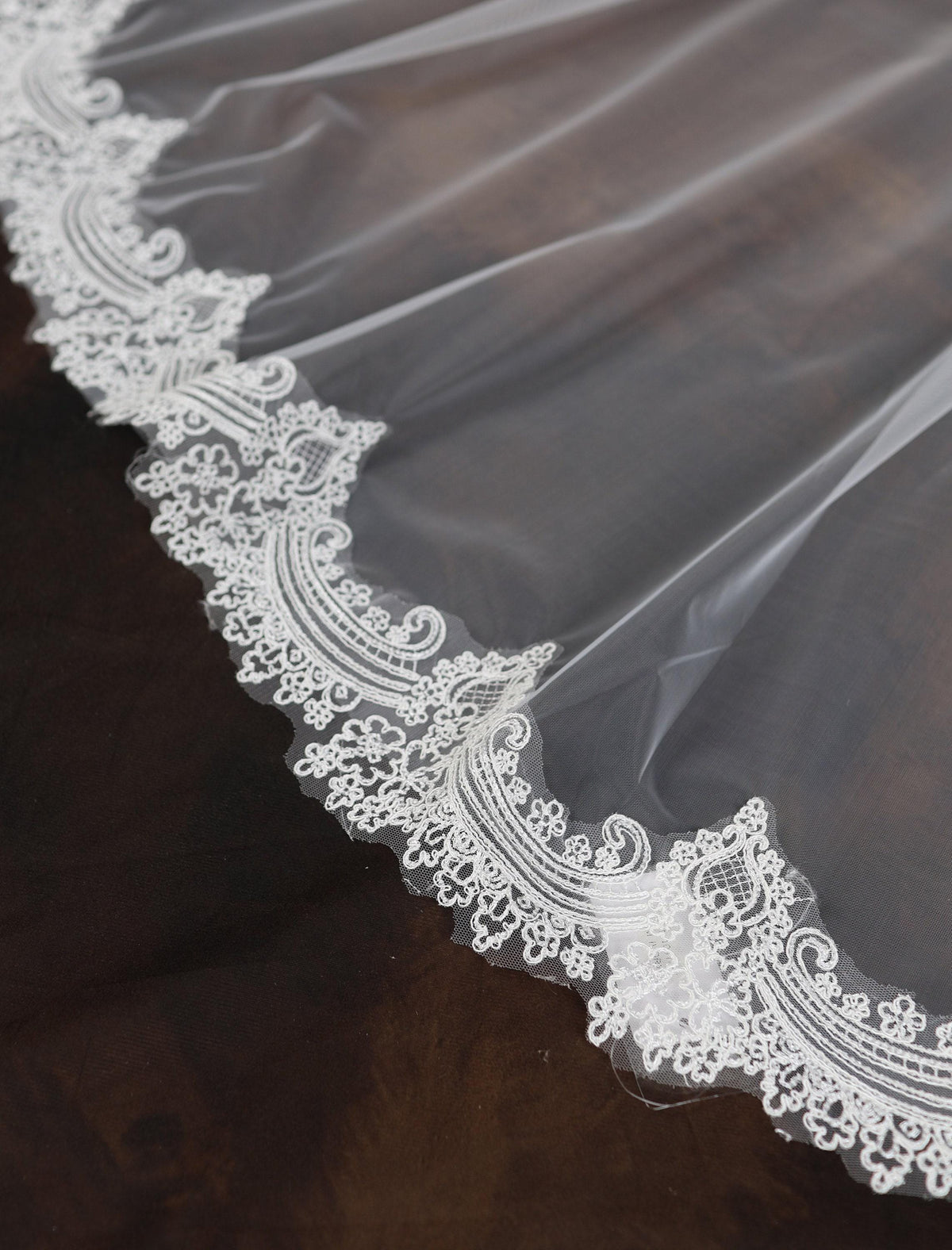 a close up of a wedding veil on a table