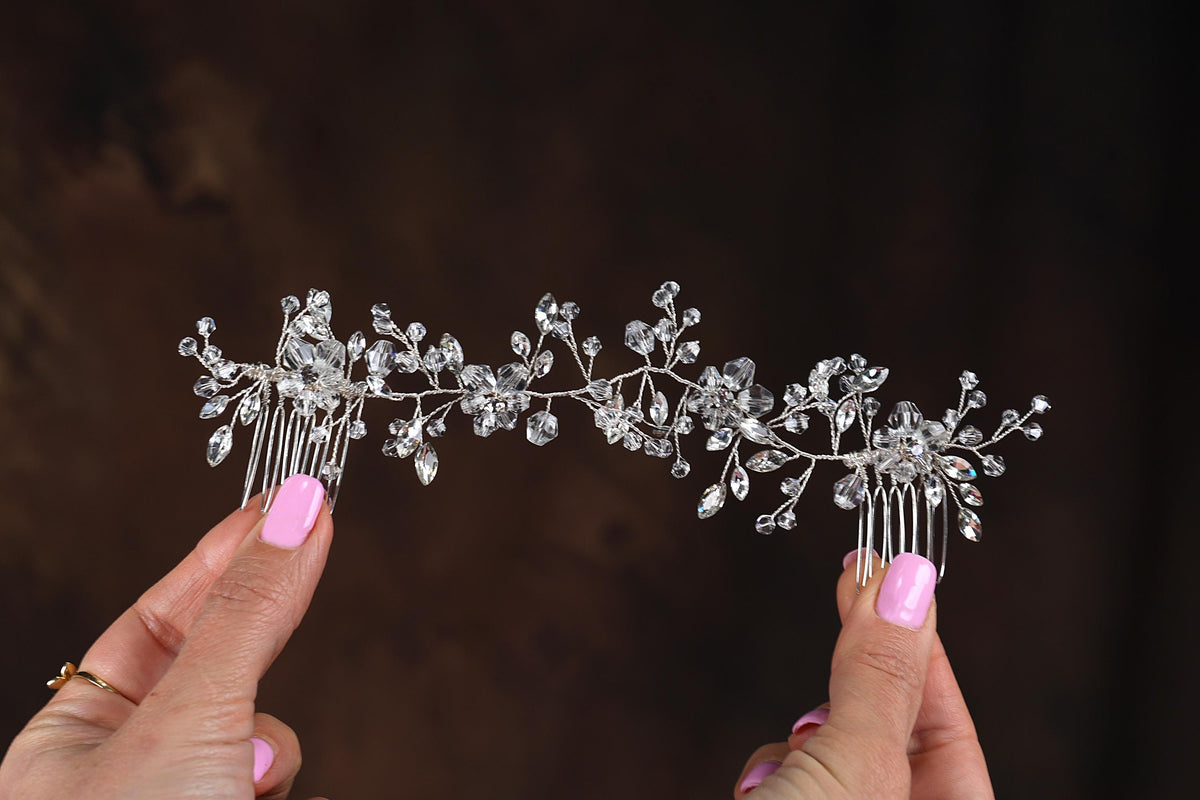 a close up of a person holding a tiara